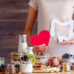 Female,Is,Holding,Figures,Of,Heart,And,Intestines.,Summer,Breakfast